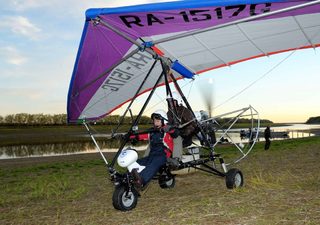 Russian President Putin flies in a motorized deltaplane at Yamalo-Nenets