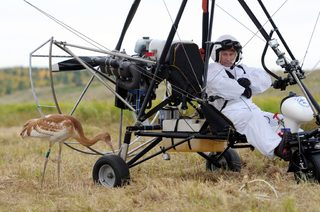 Russian President Putin sits in a motorized deltaplane at Yamalo-Nenets district