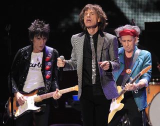 Ronnie Wood Mick Jagger and Keith Richards perform onstage during the Rolling Stones final concert of their "50 and Counting Tour" in Newark