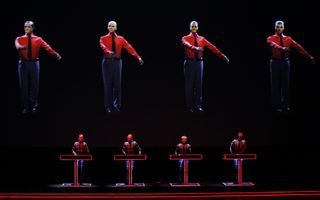 German electronic band Kraftwerk perform with a 3d stage set at the Tate Modern in London