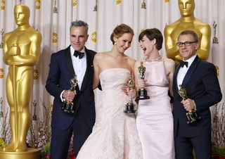 Day Lewis, Lawrence, Hathaway and Waltz, pose with their Oscars backstage at the 85th Academy Awards in Hollywood