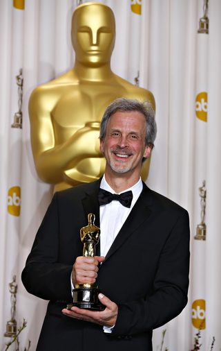 Goldenberg poses with his Oscar for Best Achievement in Film Editing for "Argo" at the 85th Academy Awards in Hollywood
