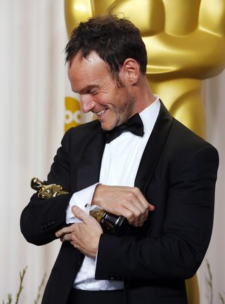 Chris Terrio cradles his Oscar he won for Best Adapted Screenplay for "Argo," at the 85th Academy Awards in Hollywood, California