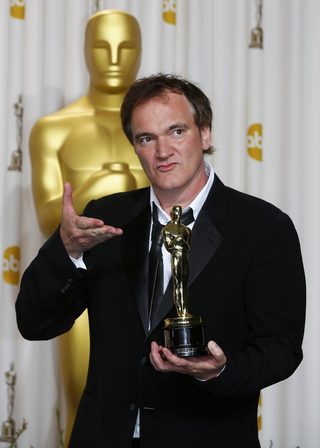 Quentin Tarantino poses with his Oscar for Best Original Screenplay for "Django Unchained" at the 85th Academy Awards in Hollywood, California