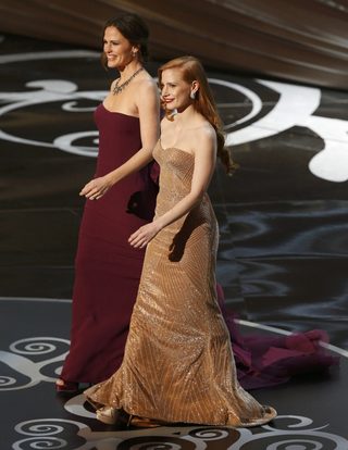Presenters Chastain and Garner walk onto the stage to give out the award for best foreign language film at the 85th Academy Awards in Hollywood