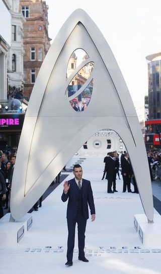 Zachary Quinto waves as he arrives at the international premiere of "Star Trek Into Darkness" in Leicester Square, central London