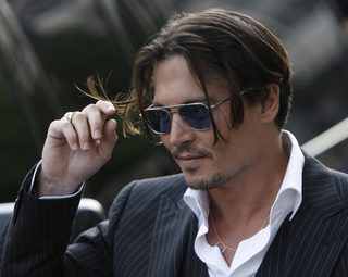 Cast member Johnny Depp arrives for a screening of "Public Enemies" in Chicago