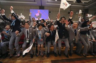 Prime Minister Shinzo Abe of Japan celebrates with members of the Tokyo bid committee as Jacques Rogge President of the International Olympic Committee announces Tokyo as the city to host the 2020 Summer Olympic Games during a ceremony in Buenos Aires