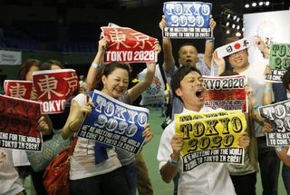 People celebrate after hearing that Tokyo had been chosen to host the 2020 Olympic Games during a public viewing event in Tokyo