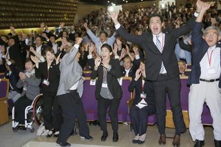 Japanese Olympians and Tokyo Olympic bidding committee members celebrate after hearing that Tokyo had been chosen to host the 2020 Olympic Games in Tokyo