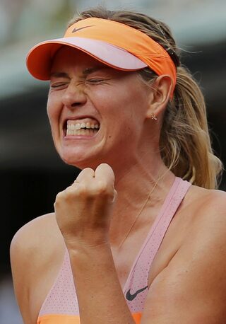 Maria Sharapova of Russia reacts during her women's singles final match against Simona Halep of Romania at the French Open tennis tournament at the Roland Garros stadium in Paris