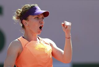 Simona Halep of Romania reacts during her women's singles final match against Maria Sharapova of Russia at the French Open tennis tournament at the Roland Garros stadium in Paris