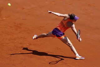 Simona Halep of Romania returns the ball to Maria Sharapova of Russia during their women's singles final match at the French Open tennis tournament at the Roland Garros stadium in Paris