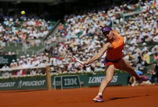 Simona Halep of Romania returns the ball to Maria Sharapova of Russia during their women's singles final match at the French Open tennis tournament at the Roland Garros stadium in Paris