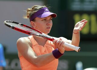 Simona Halep of Romania reacts during her women's singles final match against Maria Sharapova of Russia at the French Open tennis tournament at the Roland Garros stadium in Paris