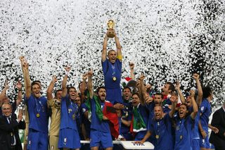 Italy's Fabio Cannavaro (C) lifts the World Cup Trophy as he celebrates with team mates after the World Cup 2006 final soccer match between Italy and France in Berlin