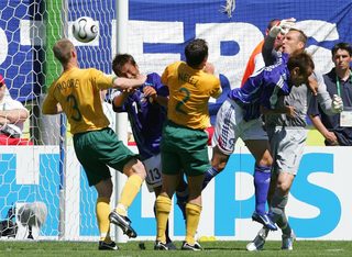 Australia's Mark Schwarzer watches a shot from Japan's Shunsuke Nakamura sail into the net during their Group F World Cup 2006 soccer match in Kaiserslautern June