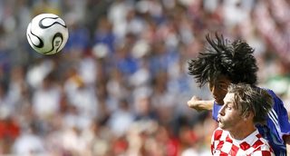 Japan's Yuji Nakazawa battles for the ball with Croatia's Ivica Olic during their Group F World Cup 2006 soccer match in Nuremberg