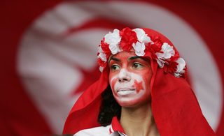 A fan waits for start of Group H World Cup 2006 soccer match between Spain and Tunisia in Stuttgart