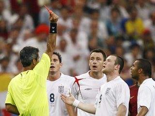 Referee Elizondo of Argentina shows England's Rooney a red card during their World Cup 2006 quarter-final soccer match against Portugal in Gelsenkirchen