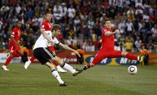 Germany's Mueller shoots to score against England during a 2010 World Cup second round soccer match at Free State stadium in Bloemfontein