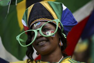 A fan looks on during an international friendly soccer match between Thailand  and South Africa at Mbombela stadium in Nelspruit