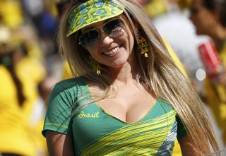 A Brazilian fan attends the opening ceremony of the 2014 World Cup at the Corinthians arena in Sao Paulo