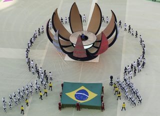 Performers take part in the 2014 World Cup opening ceremony at the Corinthians arena in Sao Paulo