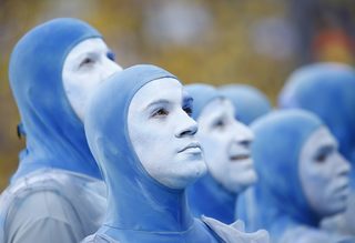 Performers look upwards during the 2014 World Cup opening ceremony at the Corinthians arena in Sao Paulo