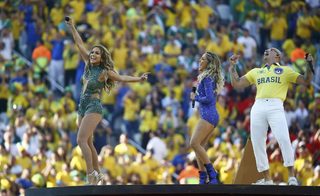 Singers Lopez, Leitte and Pitbull perform during the opening ceremony of the 2014 World Cup at the Corinthians arena in Sao Paulo