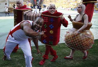 Performers pose during the opening ceremony of the 2014 World Cup at the Corinthians arena in Sao Paulo