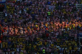 Croatian and Brazilian fans cheer before the 2014 World Cup opening ceremony at the Corinthians arena in Sao Paulo