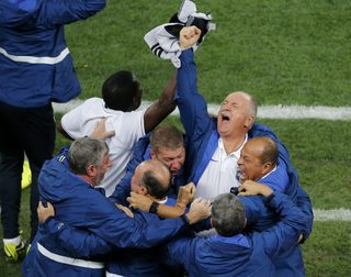 Brazil's coach Luiz Felipe Scolari celebrates after Neymar scored a goal during the 2014 World Cup opening match at the Corinthians arena in Sao Paulo