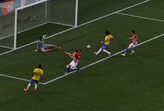 Brazil's Marcelo scores an own goal during the 2014 World Cup opening match between Brazil and Croatia at the Corinthians arena in Sao Paulo