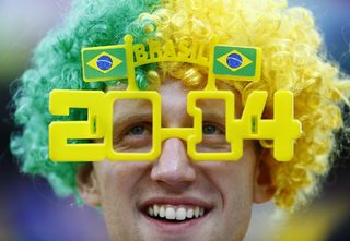 A fan looks on as he waits for the 2014 World Cup opening match between Brazil and Croatia at the Corinthians arena in Sao Paulo