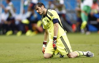 Spain's goalkeeper  Iker Casillas reacts after a goal by Netherlands during their  2014 World Cup Group B soccer match at the Fonte Nova arena in Salvador