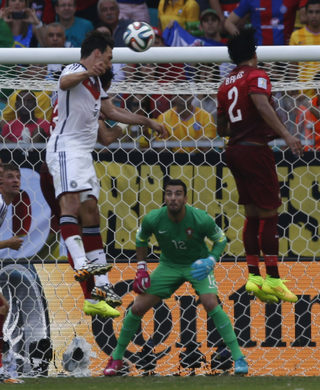 Germany's Mats Hummels scores their second goal during their 2014 World Cup Group G soccer match against Portugal at the Fonte Nova arena in Salvador