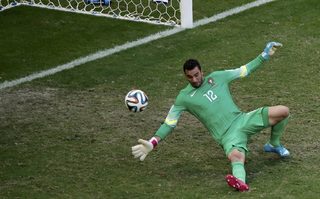 Germany's Thomas Mueller scores past Portugal goalkeeper Rui Patricio during their 2014 World Cup Group G soccer match at the Fonte Nova arena