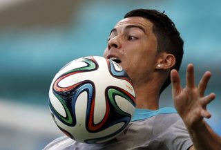 Portugal's Ronaldo controls the ball during a training session at the Arena Fonte Nova stadium ahead of their 2014 World Cup against Germany in Salvador