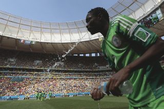 Nigeria's Musa spits out water during their 2014 World Cup round of 16 game against France at the Brasilia national stadium in Brasilia;Nigeria's Musa spits out water during their 2014 World Cup round of 16 game against France at the Brasilia national stadium in Brasilia