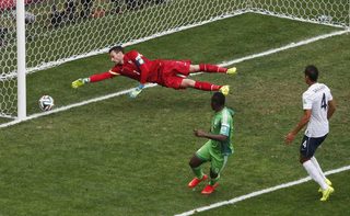 Nigeria's Emenike kicks to score a goal against France's goalkeeper Lloris, which was later ruled offside and disallowed, during their 2014 World Cup round of 16 game at the Brasilia national stadium in Brasilia;Nigeria's Emenike kicks to score a goal against France's goalkeeper Lloris, which was later ruled offside and disallowed, during their 2014 World Cup round of 16 game at the Brasilia national stadium in Brasilia