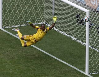 Nigeria's goalkeeper Enyeama jumps to make a save during their 2014 World Cup round of 16 game against France in Brasilia;Nigeria's goalkeeper Enyeama jumps to make a save during their 2014 World Cup round of 16 game against France in Brasilia