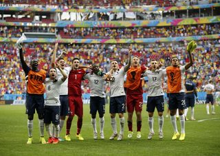 France's players celebrate after winning their 2014 World Cup round of 16 game against Nigeria at the Brasilia national stadium in Brasilia;France's players celebrate after winning their 2014 World Cup round of 16 game against Nigeria at the Brasilia national stadium in Brasilia