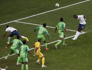 France's Pogba heads to score a goal against Nigeria during their 2014 World Cup round of 16 game in Brasilia;France's Pogba heads to score a goal against Nigeria during their 2014 World Cup round of 16 game in Brasilia