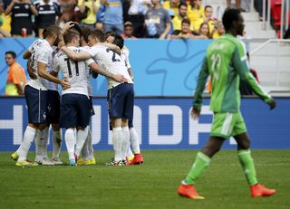 France players celebrate a goal by Paul Pogba during their 2014 World Cup round of 16 game at the Brasilia national stadium in Brasilia;France players celebrate a goal by Paul Pogba during their 2014 World Cup round of 16 game at the Brasilia national stadium in Brasilia