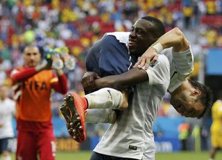 France's Matuidi and Valbuena celebrate after winning their 2014 World Cup round of 16 game against Nigeria at the Brasilia national stadium in Brasilia;France's Matuidi and Valbuena celebrate after winning their 2014 World Cup round of 16 game against Nigeria at the Brasilia national stadium in Brasilia