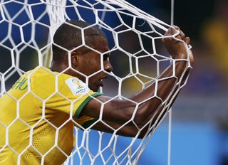 Brazil's Fernandinho reacts in his goal's net after they conceded a goal to Germany during their 2014 World Cup semi-finals at the Mineirao stadium in Belo Horizonte