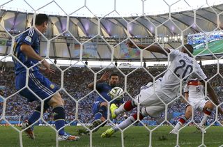 Germany's Boateng defends in front of Argentina's Lavezzi and Messi during their 2014 World Cup final at the Maracana stadium in Rio de Janeiro