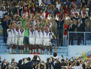 Germany's players celebrate with the World Cup trophy after the 2014 World Cup final against Argentina at the Maracana stadium in Rio de Janeiro