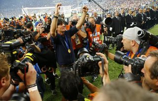 Germany's coach Joachim Loew poses for photographers after winning the 2014 World Cup final between Germany and Argentina at the Maracana stadium